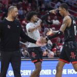 Houston Rockets coach Ime Udoka alongside Jabari Smith Jr. and Jalen Green