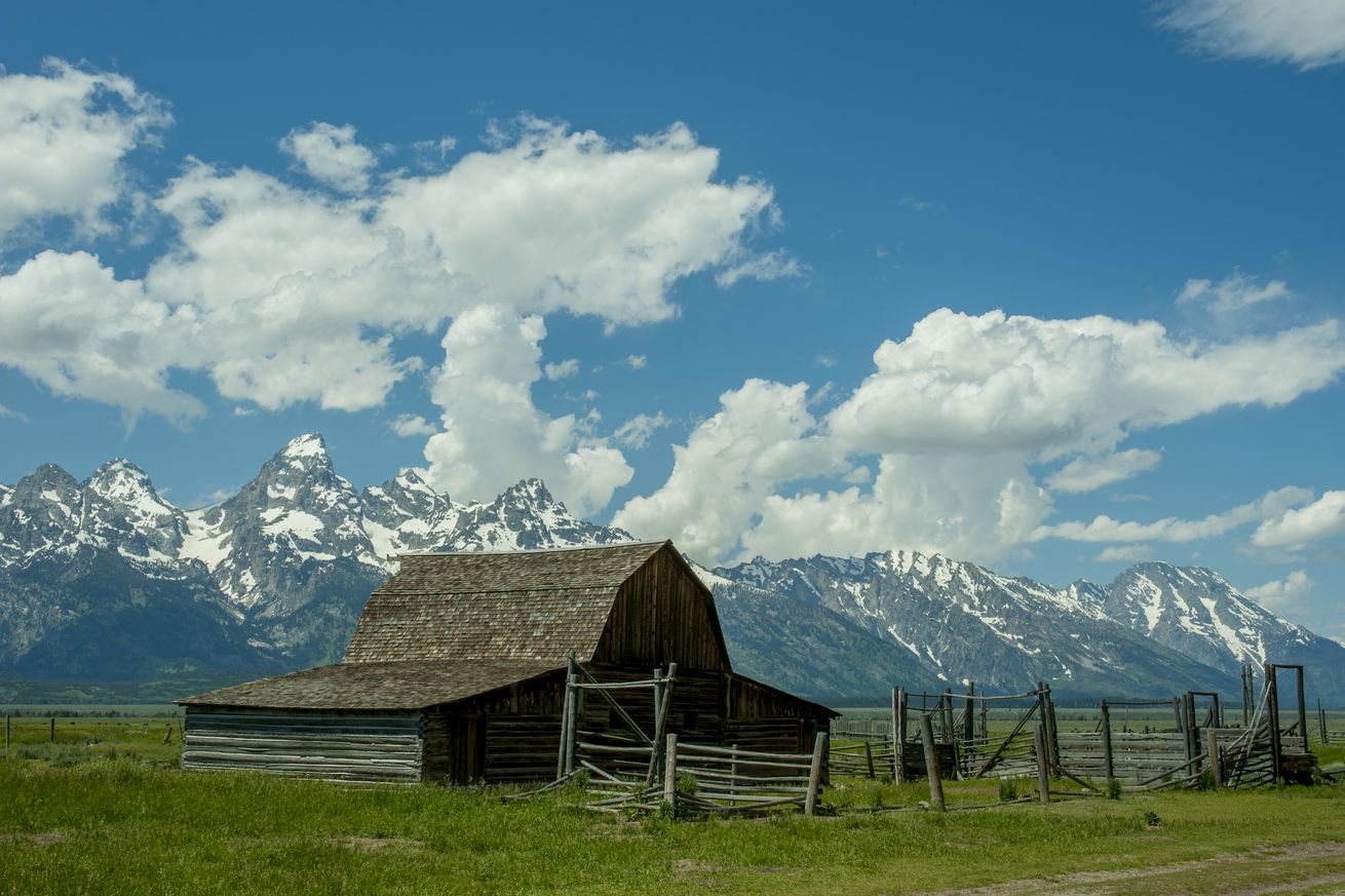 A barn at the John and Bartha Moulton Homestead (1908), Mormon Row, in the Grand Teton National Park, Wyoming, United States, with the Grand Teton Mountains in the background.