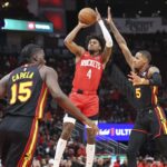 Atlanta Hawks guard Dejounte Murray contests shot by Houston Rockets wing Jalen Green