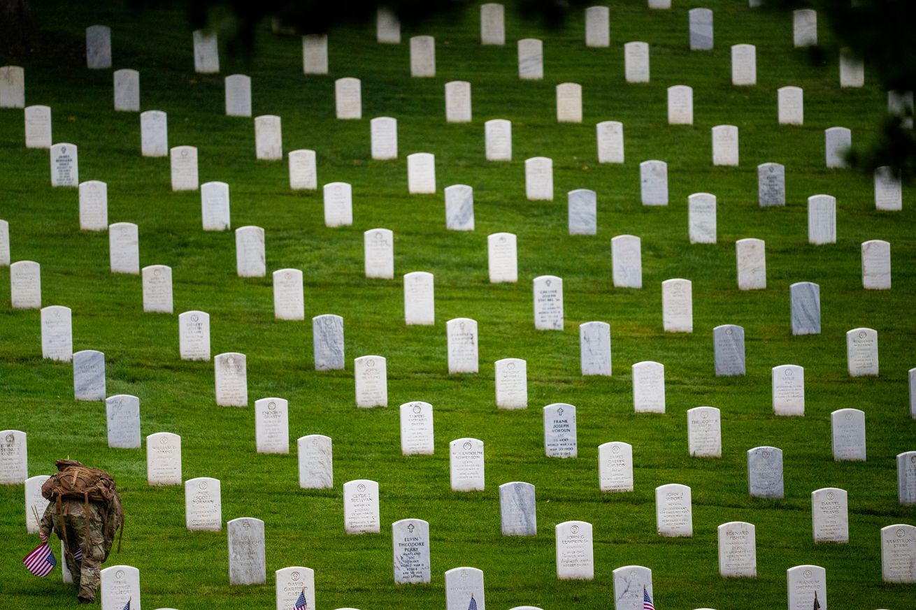 Flags In Takes Place At Arlington National Cemetery Ahead Of Memorial Day