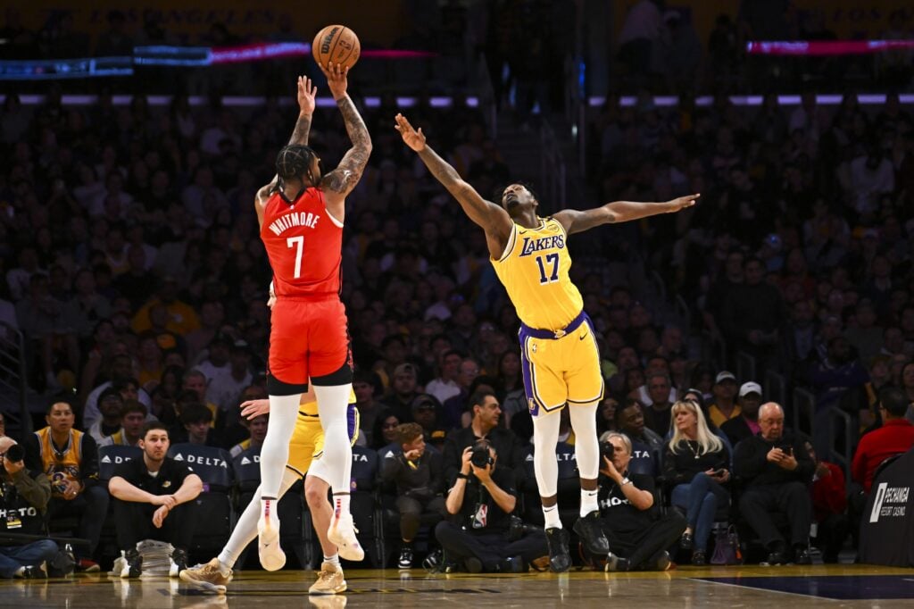 Apr 11, 2025; Los Angeles, California, USA; Los Angeles Lakers forward Dorian Finney-Smith (17) attempts to block against Houston Rockets forward Cam Whitmore (7) during the first half at Crypto.com Arena. Mandatory Credit: Jonathan Hui-Imagn Images