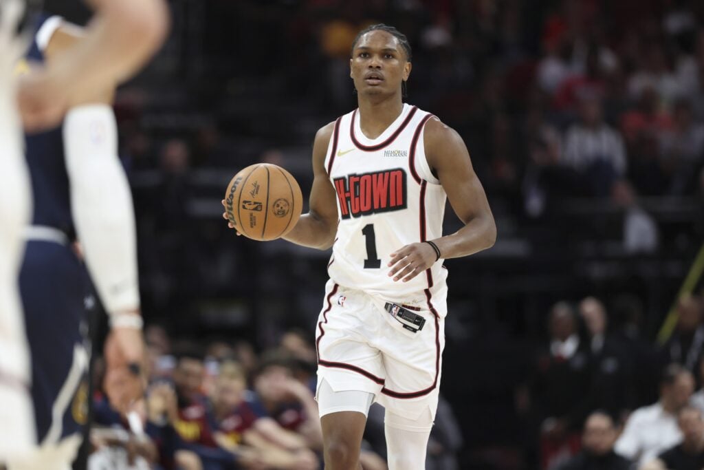 Houston Rockets forward Amen Thompson (1) brings the ball up the court during the game against the Denver Nuggets at Toyota Center.