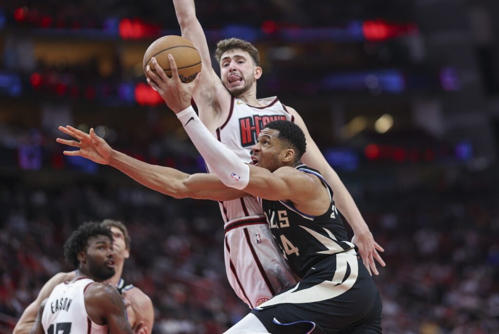 Houston Rockets center Alperen Sengun guards Milwaukee Bucks forward Giannis Antetokounmpo